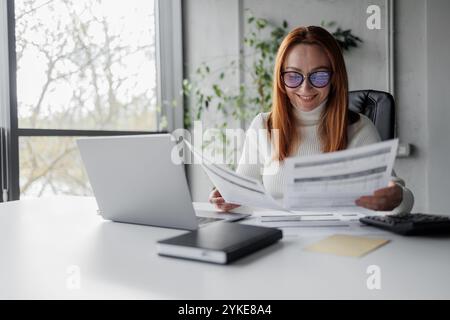 Businesswoman Analyzing Documents Stock Photo