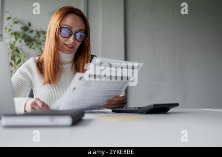 Businesswoman Analyzing Documents Stock Photo