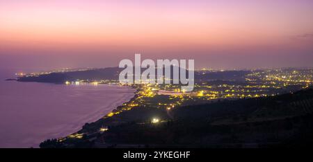 Sunrise over the island of Zakhyntos from a vantage point on the rocks Stock Photo