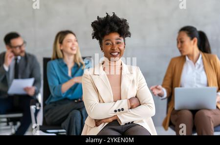 Successful businesswoman executive, leader discussing project management with diverse colleague Stock Photo