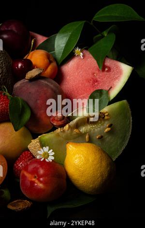 Close-up of fruits and flowers, black background Stock Photo