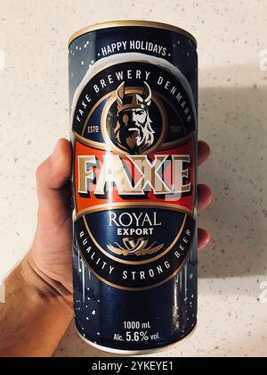 Kyiv, Ukraine - September 20, 2020: A close-up view of a Faxe beer can being held in a hand, showcasing the label design and branding. The can display Stock Photo