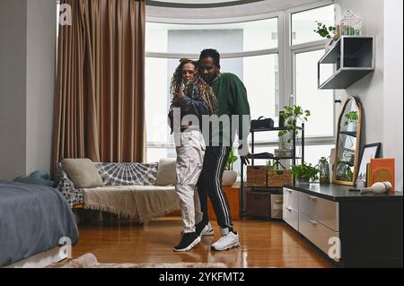 Young Couple Practicing Dance At Home Stock Photo