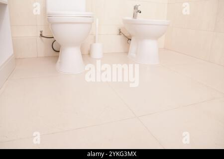 White big tile floor background. Clean surface bathroom, toilet, wc, restroom. Top view Stock Photo