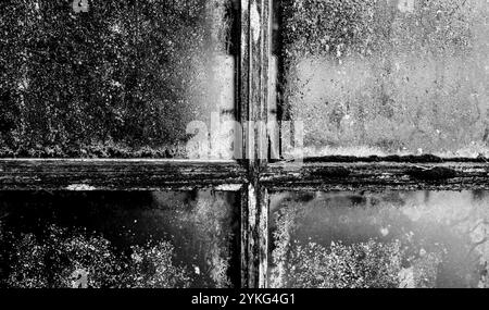 Frosted window pane in old garden hut Stock Photo