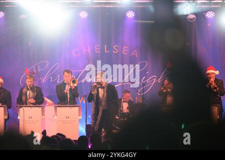 London, UK, 16th November 2024, The Christmas Lights were switched on around Chelsea's Kings Road, Sloane Square and the Duke of York Square. Performing were the Chelsea Pensioners, IDA Girls, Vocal Works Gospel Choir and Steve Trowell & The Diamond Skyline Orchestra., Andrew Lalchan Photography/Alamy Live News Stock Photo