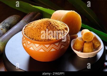 Jaggery powder with jaggery cubes. Jaggery is used as an ingredient in sweet and savoury dishes in the cuisines of India. Stock Photo