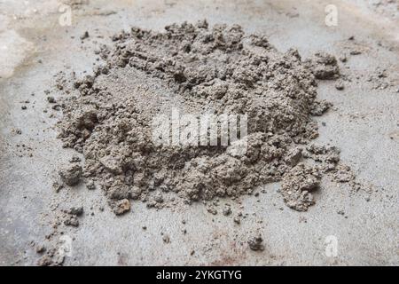 pile of mortar or cement mixture, rough, granular texture of cement and sand mixture for construction or repair work Stock Photo