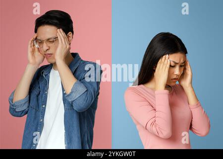 Asian couple having headache, touching their heads Stock Photo