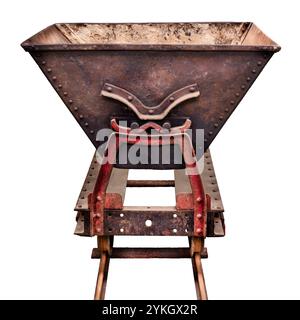 Ancient rusted and weathered mine wagon on a railroad track isolated on a white background Stock Photo