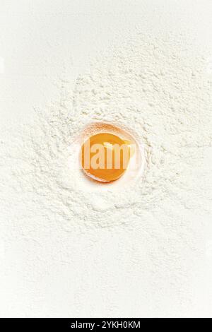Flour, with egg yolk, texture, food background, top view, pasta, no people Stock Photo