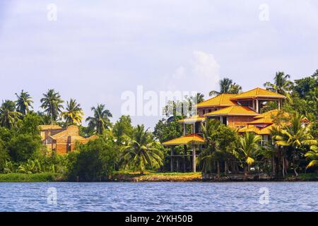 Boat safari trip jetty house boats through mangrove jungle forest in Bentota Ganga River Lake in Bentota Beach Galle District Southern Province Sri La Stock Photo