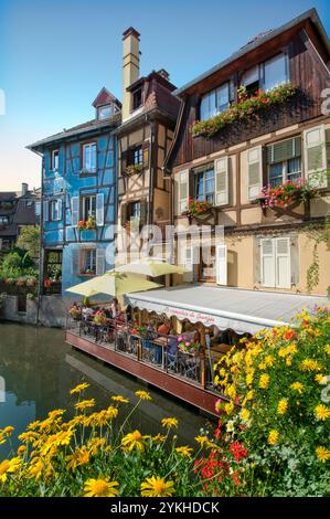 ALSACE ALFRESCO waterside restaurant Petite Venise 'Little Venice'  waterside floral character alfresco restaurant Colmar Alsace France Stock Photo