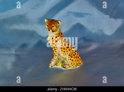 Royal Crown Derby. Porcelain Cheetah Cub figurine. Sitting upright Stock Photo