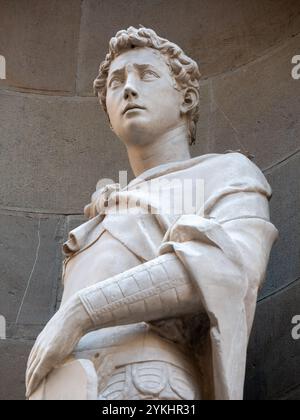 Florence, ITALY- November 11, 2024: The statue of Saint George the Warrior 1416-1417 by Donatello in the external niches of the church of Orsanmichele Stock Photo