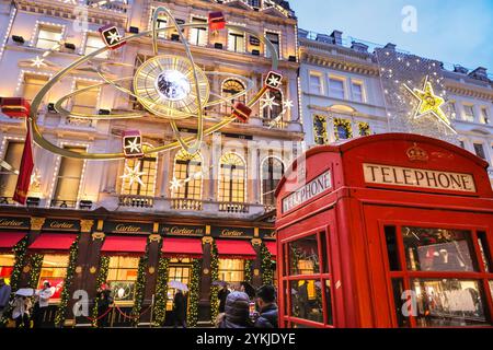 London, UK. 18th Nov, 2024. The 'Christmas at Cartier' light installation features an inter gallactic display in Old Bond Street. Christmas Lights, baubles and elaborate decorations have been put up along Bond Street and its luxury shops, Piccadilly, Burlington Arcade and all through Mayfair in anticipation of the the busy Christmas shopping season. Credit: Imageplotter/Alamy Live News Stock Photo