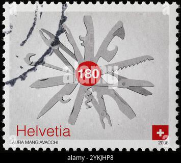 Tools of Swiss Army knife on postage stamp Stock Photo