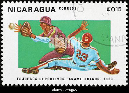 Baseball players in action on postage stamp from Nicaragua Stock Photo