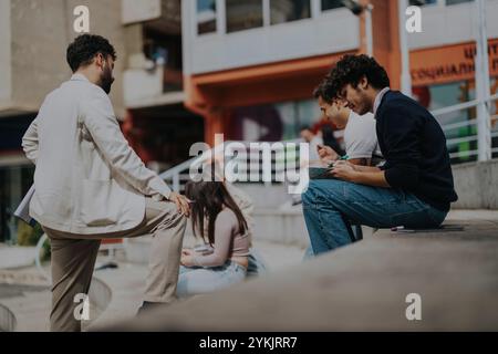 Group of students outdoor collaborating with engaged professor Stock Photo