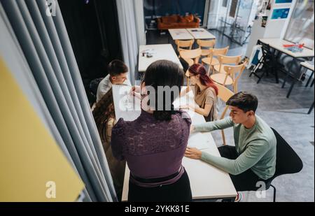 Creative art class with students drawing in studio setting Stock Photo