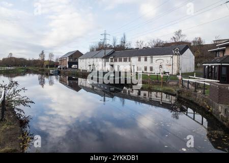 Series of Whitewashed Canal Buildings Built as Warehouses, Oldest Remaining Buildings on Canal (Claypits on Port Dundas) Now Boarded Stock Photo