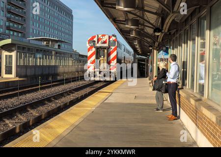 Inbound Metra Union Pacific West train arriving at the Oak Park, Illinois station. Stock Photo