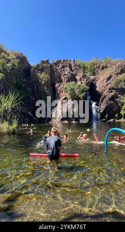 The Wangi Falls a popular swimming spot, has two misty waterfalls filling the huge swimming hole. The waterfalls create a natural plunge pool in the r Stock Photo