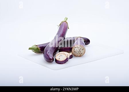 Healthy vegetable purple eggplant photographed on white background and base Stock Photo