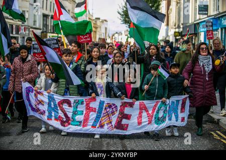 Brighton, United Kingdom. 05 November 2023. Thousands of demonstrators join a march in Brighton to demand an immediate ceasefire in the Gaza Strip, amid the Israeli military offensive in the Palestinian enclave and ongoing pro-Gaza demonstrations around the world. On Sunday at least 30,000 people attended a protest in London calling for a ceasefire in the pounded Palestinian enclave, where nearly 1,000 Palestinians, half of whom are children have been killed since Oct.7. In the latest few days Israeli forces have further intensified their bombardments in the Strip particularly in highly crowde Stock Photo