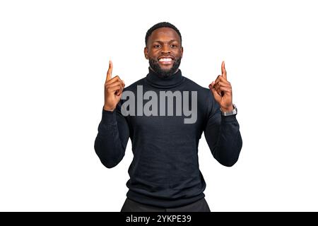 Studio shot of a cheerful businessman pointing up with both index fingers while smiling at the camera Stock Photo