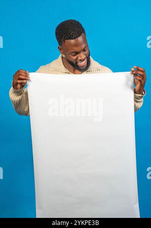 Man showing blank vertical banner with copy space for advertisement or message Stock Photo