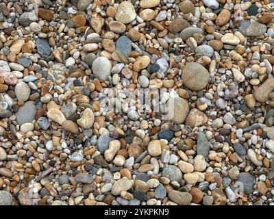 Background - Pebbles on a beach on the south coast of Devon in the United Kingdom. Stock Photo
