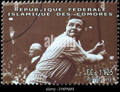 Babe Ruth in action during a match on stamp of Comoros Stock Photo