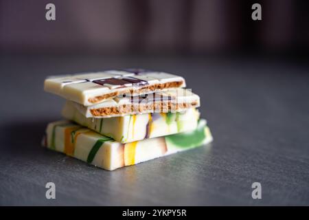Piece of trend Dubai white chocolate with halva paste. Confectionery handmade sweets at home in the kitchen.  Stock Photo