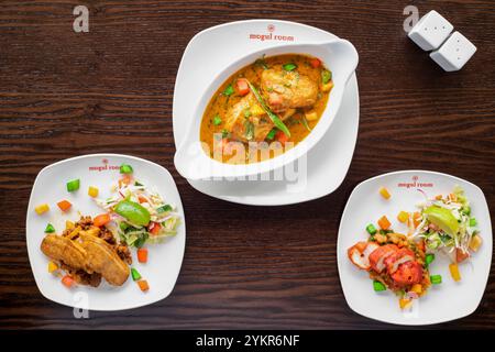 Yorkshire, UK – 13 June 2019 : delicious Indian food including chicken tikka, curried duck and spiced prawns  from The Mogul Room, Barnsley Stock Photo