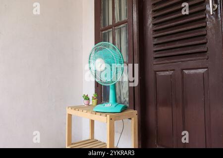 Table fan placed on the terrace Stock Photo