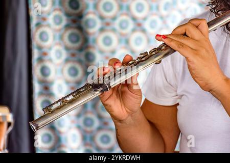 Musical performance with transverse flute being played by a woman in Brazil Stock Photo