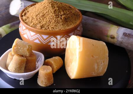Jaggery Powder, Brown sugar, sugarcane cubes in bowl, Jaggery Powder is a alternative of Sugar and its chemical free powder. Stock Photo
