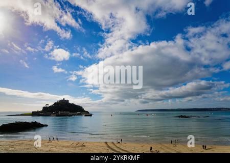 Silhouette of St Michaels Mount with white clouds and blue sky Marazion Cornwall England UK Stock Photo