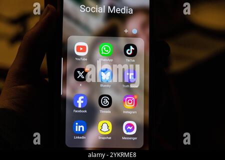 This photo illustration a smartphone screen displays the logo of social media app Bluesky besides L the logo of US online social media and social networking site X formerly known as Twitter and R the logo of Donald Trump s Truth Social app, on November 19, 2024 in Copenhagen, Denmark. On the top row left to right, the logo of online video sharing and social media platform YouTube is seen alongside that of that of Whatsapp and TikTok. Along the bottom row, left to right, is the logo for Facebook, Threads, Instagram, LinkedIn, Snapchat and Messenger. Millions of users have been leaving Elon Musk Stock Photo