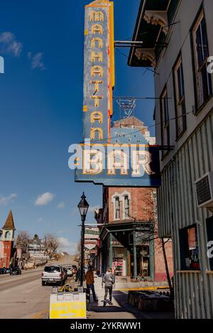 Looking down Harrison Avenue at the historic district, the family owned Manhattan Bar (opened 1943) in the foreground, Leadville, Colorado, USA. Stock Photo