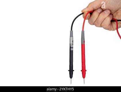 Hand Holding Red and Black Multimeter Probes Stock Photo