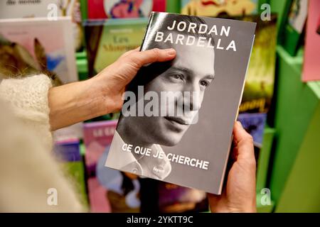 This photograph, taken on November 9, 2024, shows the first book by Jordan Bardella, president of the French far-right Rassemblement National (National Rally) party, titled Ce Que Je Cherche, on display among other political titles at a bookshop in Paris. Scheduled for release on November 19, 2024, the book combines campaign anecdotes, childhood memories, and political reflections. It is set to be the focus of an extensive promotional campaign, prominently supported by media outlets owned by the Bollore Group, which also owns the book's publisher, Fayard. (Photo by Adnan Farzat/NurPhoto)0 Stock Photo