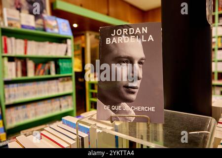 This photograph, taken on November 9, 2024, shows the first book by Jordan Bardella, president of the French far-right Rassemblement National (National Rally) party, titled Ce Que Je Cherche, on display among other political titles at a bookshop in Paris. Scheduled for release on November 19, 2024, the book combines campaign anecdotes, childhood memories, and political reflections. It is set to be the focus of an extensive promotional campaign, prominently supported by media outlets owned by the Bollore Group, which also owns the book's publisher, Fayard. (Photo by Adnan Farzat/NurPhoto)0 Stock Photo