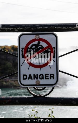 Danger sign posted on the railing in Niagara Falls, Ontario, Canada ...