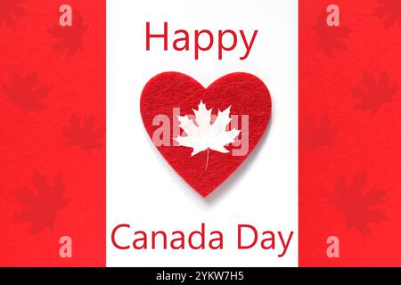 Happy Canada Day greeting card. Red Heart on Canada flag Stock Photo