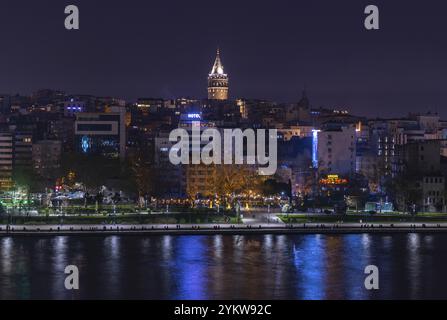 A picture of the Beyoglu district waterfront and the Galata Tower at night Stock Photo