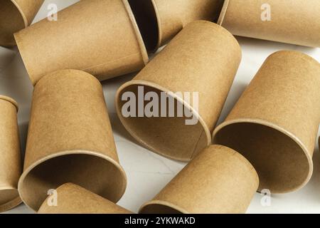 Many brown disposable empty paper cups. Containers for beverage Stock Photo