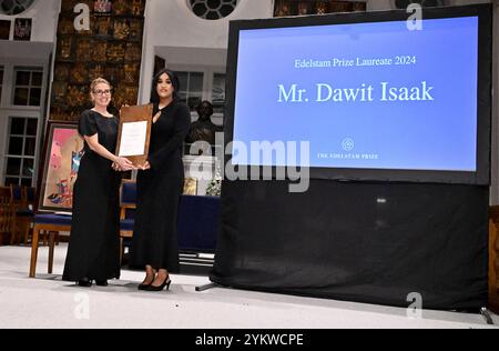 Betlehem Isaak, daughter of Dawit Isaak, receives the Edelstam Prize 2024 on behalf of her father from the hand of Caroline Edelstam. The Edelstamp Prize is awarded to Dawit Isaak for his outstanding efforts and exceptional courage in standing up for freedom of expression, his convictions and the defense of human rights. Caroline Edelstam is the granddaughter of Harald Edelstam and co-founder of the Edelstamp Prize and chairman of the international prize jury. The prize is awarded at a ceremony at Riddarhuset in Stockholm, Sweden 19 November 2024.Photo: Claudio Bresciani/TT/Code 10090 Stock Photo