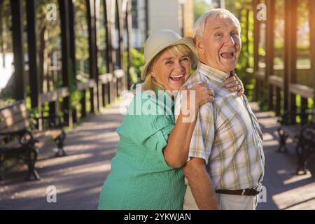 Senior woman hugging man. Elderly couple is laughing. Trust and support. Live entire life together Stock Photo
